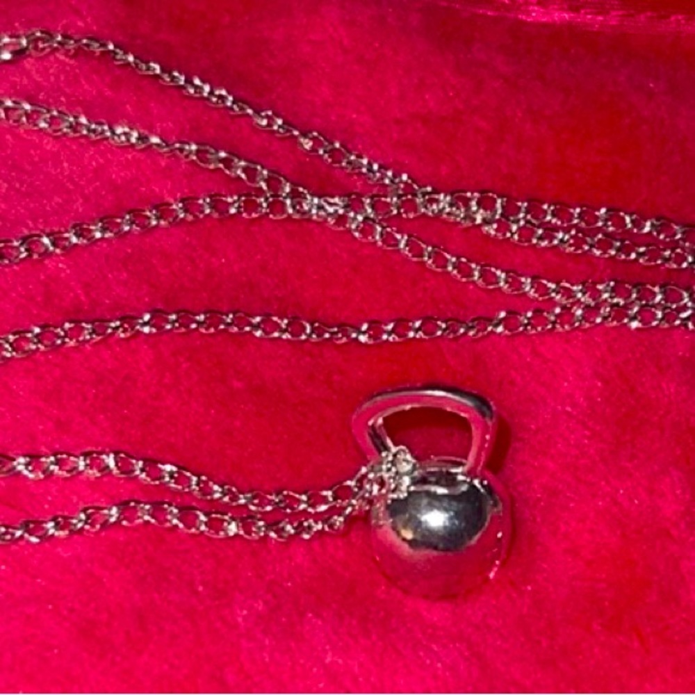 Kettlebell necklace. New in bag.